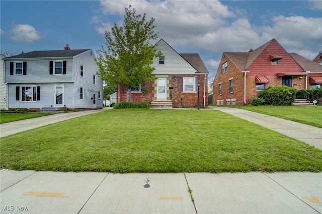 21411 Clare Ave, Maple Heights, OH 44137 - view of front of property featuring a front yard and brick siding