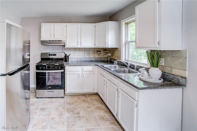 21411 Clare Ave, Maple Heights, OH 44137 - kitchen with appliances with stainless steel finishes, under cabinet range hood, a sink, and white cabinetry
