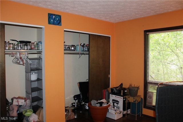 635 N Hametown Rd, Akron, OH 44333 - bedroom with multiple windows and a textured ceiling