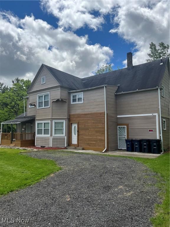 1264 Diagonal Rd, Akron, OH 44307 - view of front of house featuring a chimney and a front lawn