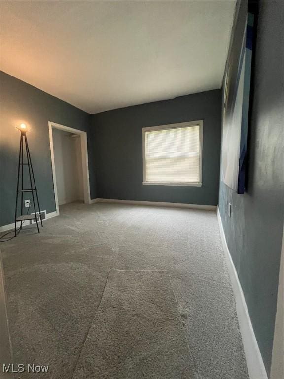 1264 Diagonal Rd, Akron, OH 44307 - unfurnished bedroom with carpet flooring, baseboards, and a closet