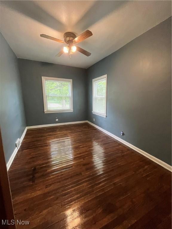 1264 Diagonal Rd, Akron, OH 44307 - spare room with dark wood-style floors, ceiling fan, and baseboards