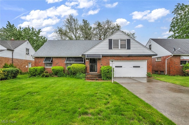 313 E 244th St, Euclid, OH 44123 - view of front of house featuring brick siding, concrete driveway, and a front yard