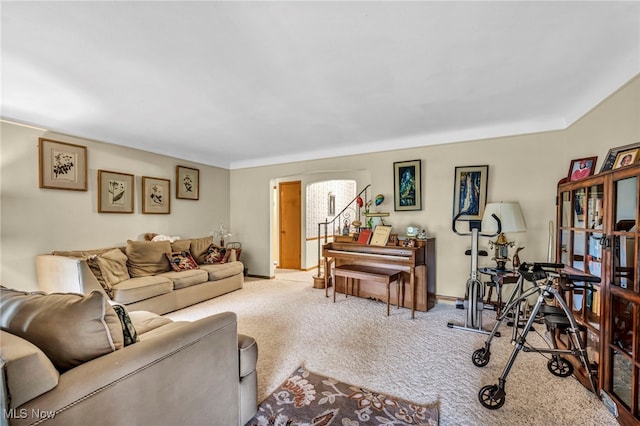 313 E 244th St, Euclid, OH 44123 - living area featuring carpet flooring, baseboards, and arched walkways