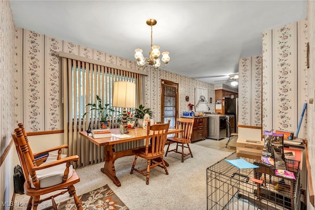 313 E 244th St, Euclid, OH 44123 - dining area featuring wallpapered walls, a chandelier, and separate washer and dryer