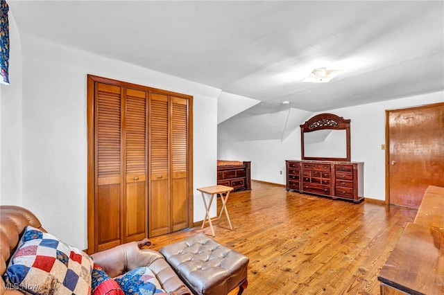 313 E 244th St, Euclid, OH 44123 - living area with wood finished floors, lofted ceiling, and baseboards