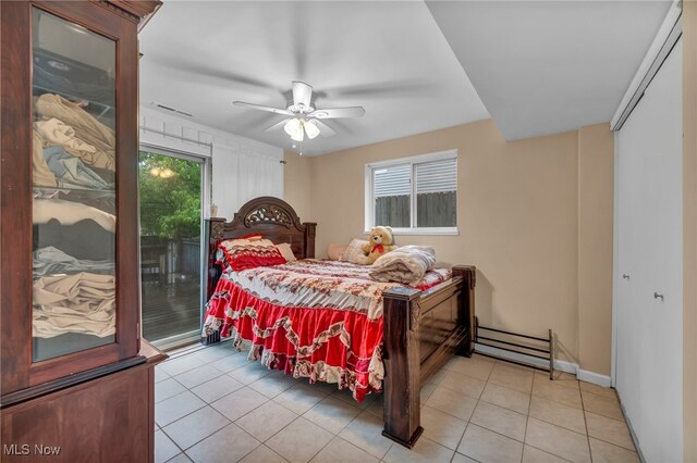 1654 Vicgross Ave, Akron, OH 44310 - bedroom with access to exterior, light tile patterned floors, baseboards, and ceiling fan