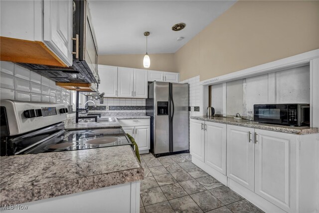 1654 Vicgross Ave, Akron, OH 44310 - kitchen featuring stainless steel appliances, a sink, white cabinets, lofted ceiling, and pendant lighting