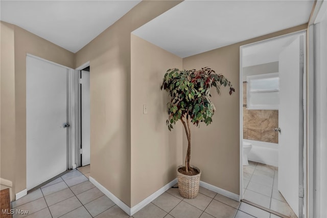 1654 Vicgross Ave, Akron, OH 44310 - entryway featuring light tile patterned floors and baseboards