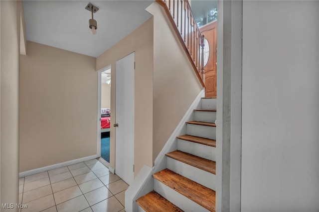 1654 Vicgross Ave, Akron, OH 44310 - stairs featuring baseboards and tile patterned flooring