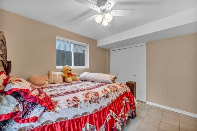 1654 Vicgross Ave, Akron, OH 44310 - bedroom featuring baseboards, light tile patterned floors, a closet, and ceiling fan