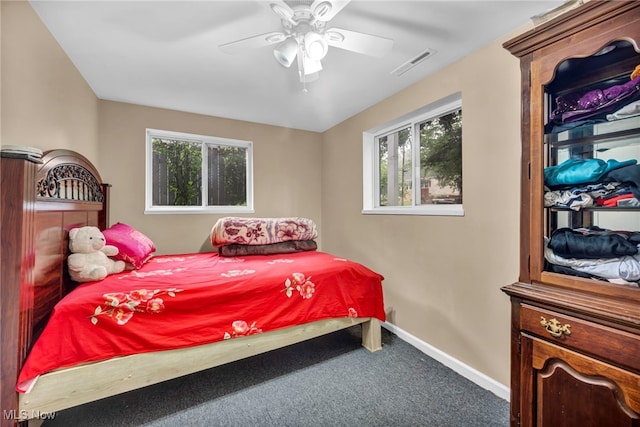 1654 Vicgross Ave, Akron, OH 44310 - carpeted bedroom featuring multiple windows, baseboards, and ceiling fan