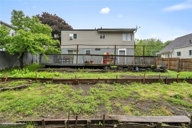 1654 Vicgross Ave, Akron, OH 44310 - rear view of property featuring a garden, a wooden deck, and a fenced backyard