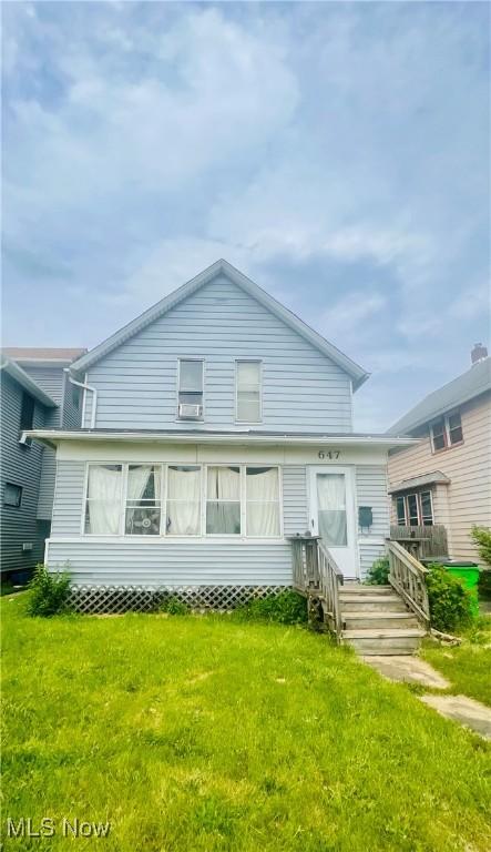 647 Wooster Rd W, Barberton, OH 44203 - back of house with a lawn