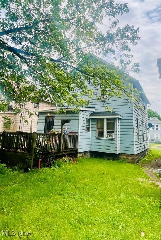 647 Wooster Rd W, Barberton, OH 44203 - back of property featuring a wooden deck and a yard