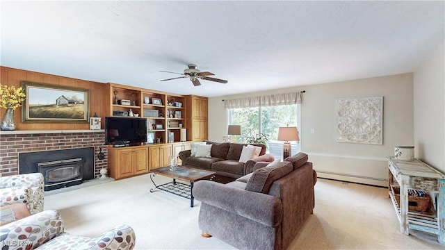 7700 Clarion Dr, Chagrin Falls, OH 44022 - living area featuring light carpet, a baseboard radiator, a ceiling fan, and a wood stove