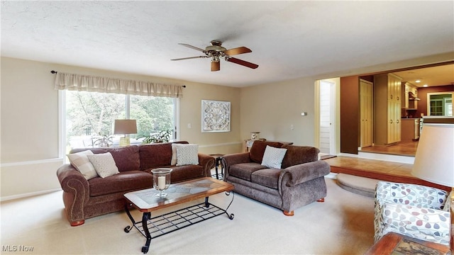 7700 Clarion Dr, Chagrin Falls, OH 44022 - living area featuring ceiling fan, light carpet, and baseboards