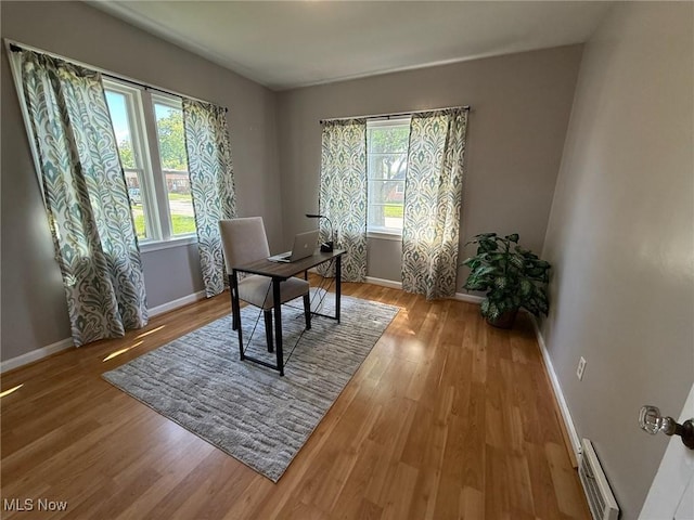 1089 Homestead Rd, South Euclid, OH 44121 - office featuring baseboard heating, wood finished floors, and baseboards