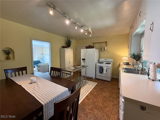 1089 Homestead Rd, South Euclid, OH 44121 - dining area with rail lighting and dark flooring