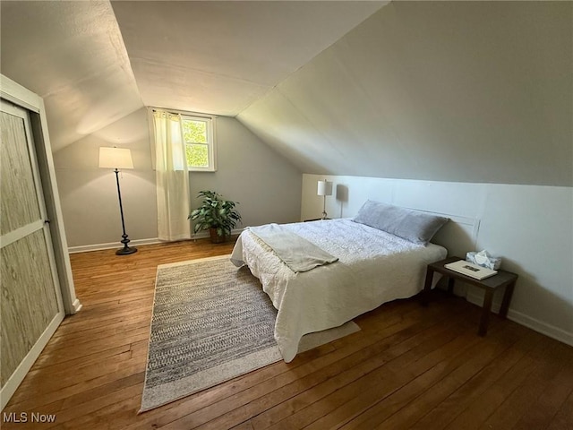 1089 Homestead Rd, South Euclid, OH 44121 - bedroom with hardwood / wood-style flooring, baseboards, and lofted ceiling