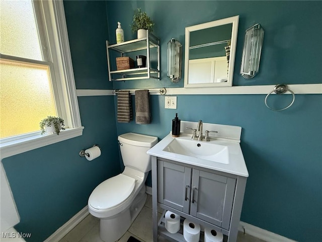 1089 Homestead Rd, South Euclid, OH 44121 - bathroom with baseboards, healthy amount of natural light, and toilet
