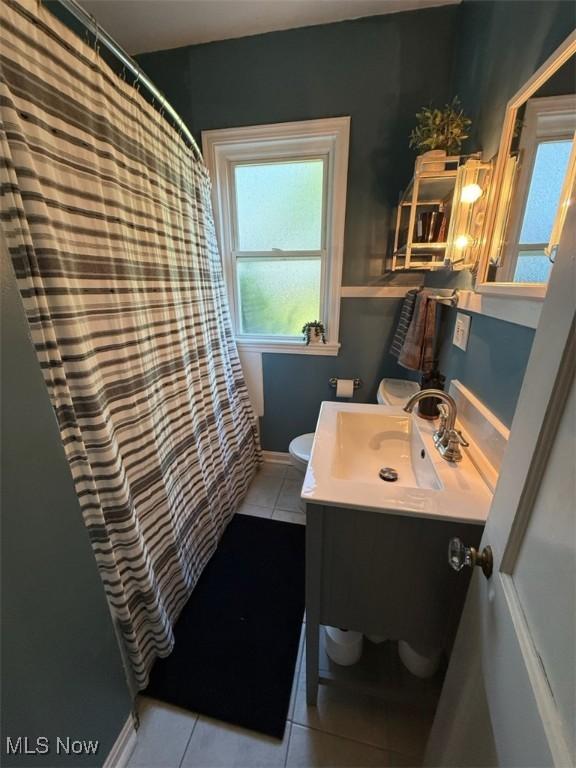 1089 Homestead Rd, South Euclid, OH 44121 - bathroom with toilet, tile patterned flooring, vanity, and a shower with curtain