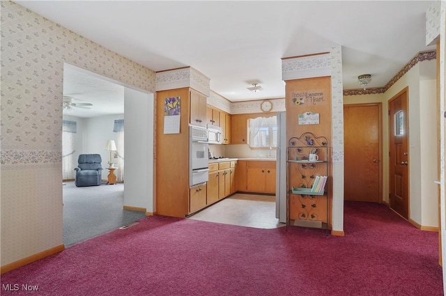 1783 Depot Rd, Salem, OH 44460 - kitchen featuring wallpapered walls, white appliances, a warming drawer, light colored carpet, and light countertops