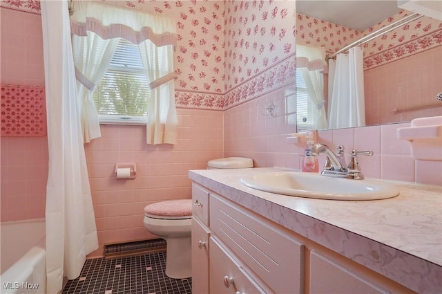 1783 Depot Rd, Salem, OH 44460 - bathroom with wallpapered walls, tile walls, vanity, toilet, and tile patterned flooring