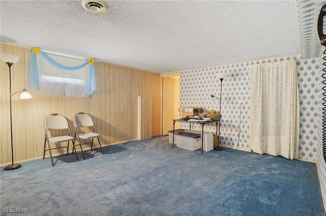1783 Depot Rd, Salem, OH 44460 - living area with a textured ceiling, carpet, and wooden walls