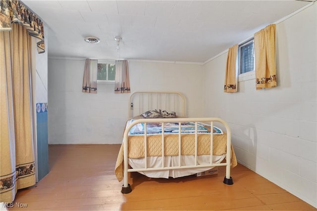 1783 Depot Rd, Salem, OH 44460 - bedroom featuring hardwood / wood-style floors, concrete block wall, and ornamental molding