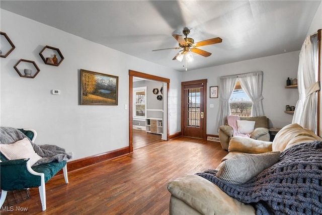 2445 Pigeon Run Rd SW, Massillon, OH 44647 - living area with a ceiling fan, baseboards, and wood finished floors