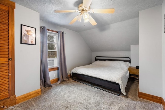 2445 Pigeon Run Rd SW, Massillon, OH 44647 - bedroom with carpet flooring, baseboards, ceiling fan, a textured ceiling, and vaulted ceiling