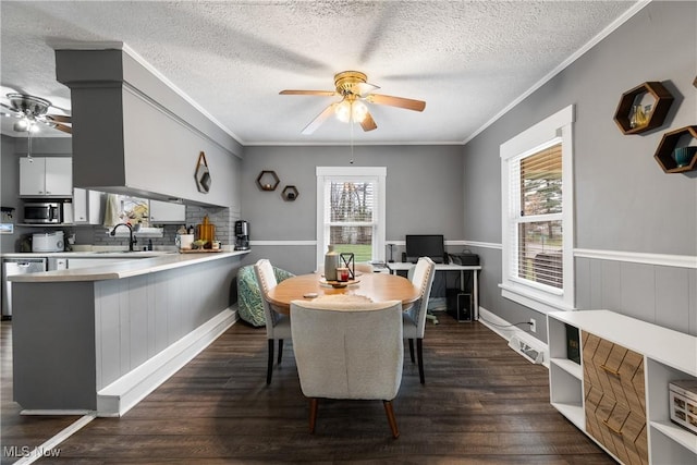2445 Pigeon Run Rd SW, Massillon, OH 44647 - dining area with a ceiling fan, dark wood-type flooring, crown molding, a textured ceiling, and a desk