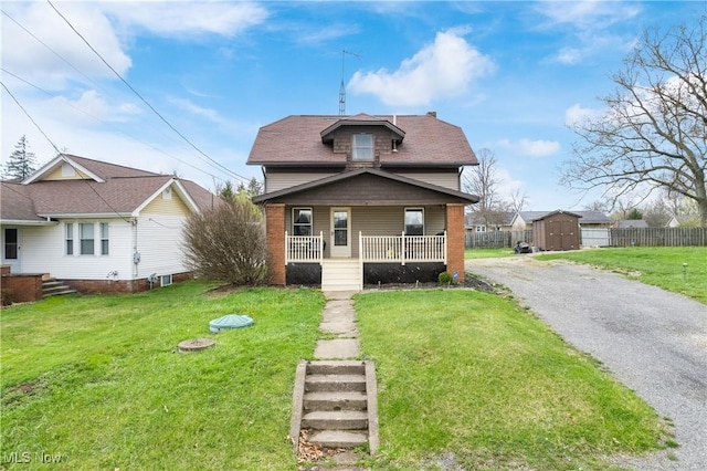 2445 Pigeon Run Rd SW, Massillon, OH 44647 - bungalow-style house with a porch and gravel driveway