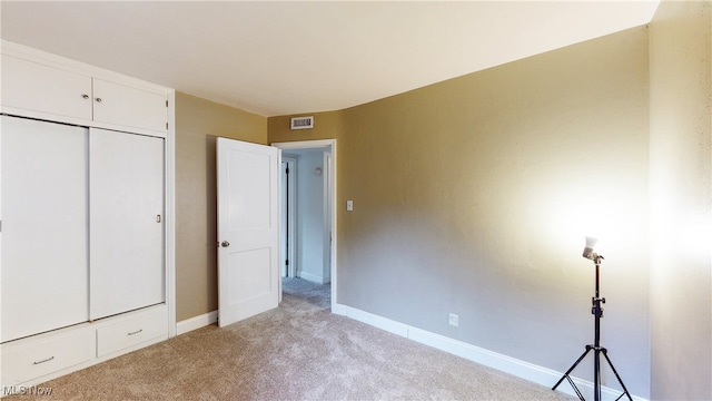 2364 Suncrest Dr, Cuyahoga Falls, OH 44221 - unfurnished bedroom with light colored carpet, baseboards, and a closet