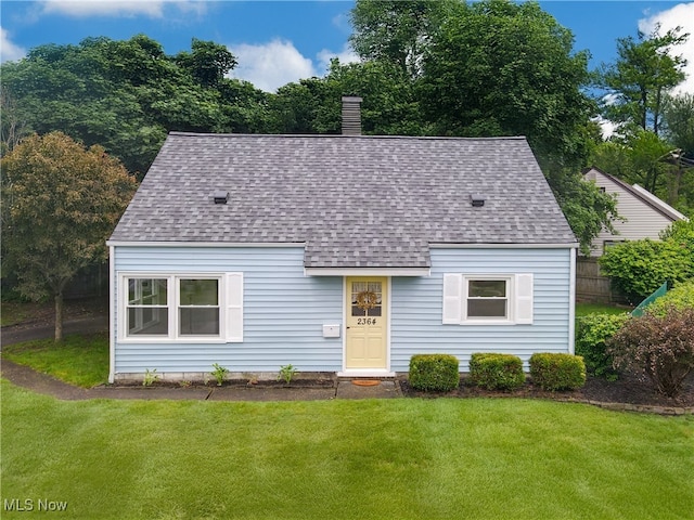 2364 Suncrest Dr, Cuyahoga Falls, OH 44221 - view of front facade with roof with shingles, a front lawn, and a chimney