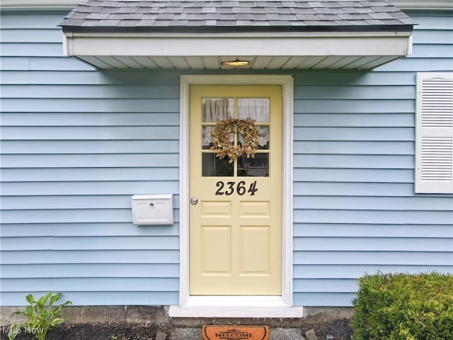 2364 Suncrest Dr, Cuyahoga Falls, OH 44221 - property entrance with roof with shingles
