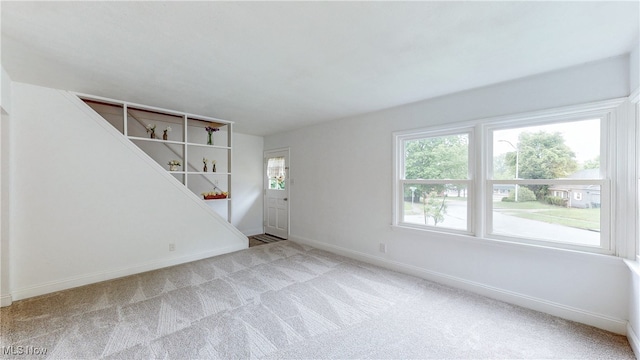 2364 Suncrest Dr, Cuyahoga Falls, OH 44221 - unfurnished living room featuring carpet and baseboards