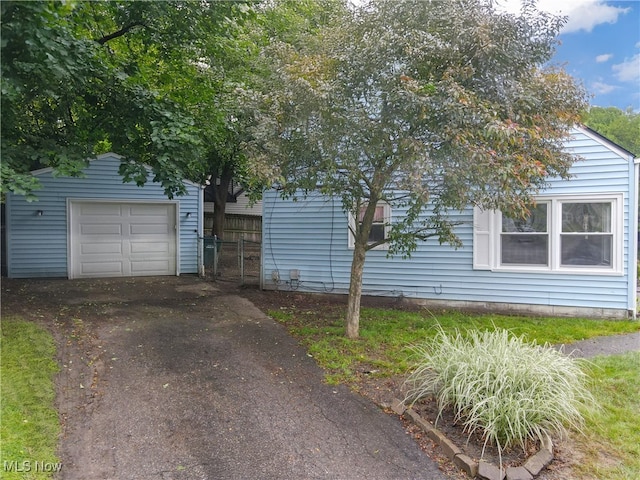 2364 Suncrest Dr, Cuyahoga Falls, OH 44221 - view of front of property featuring asphalt driveway, an outbuilding, and a detached garage