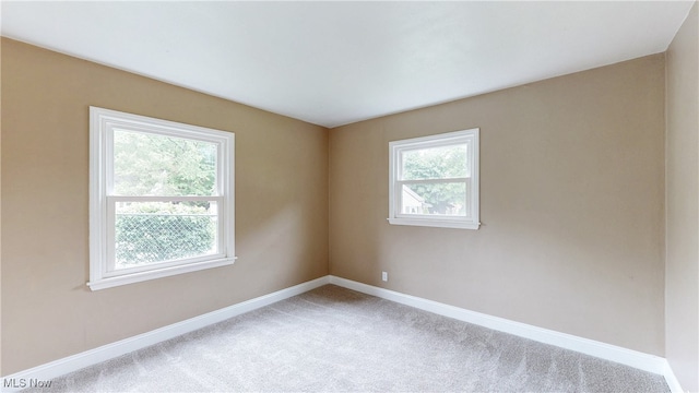 2364 Suncrest Dr, Cuyahoga Falls, OH 44221 - spare room featuring baseboards and carpet flooring