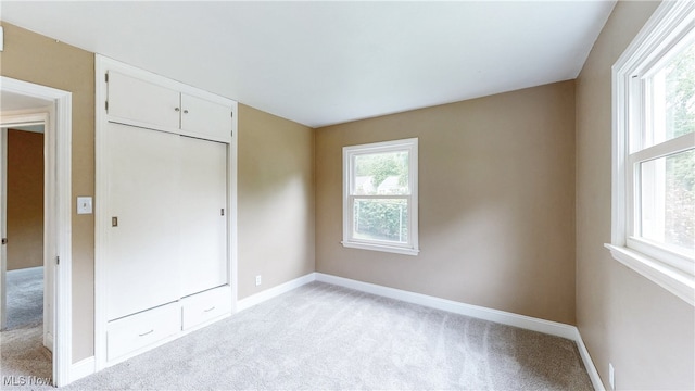 2364 Suncrest Dr, Cuyahoga Falls, OH 44221 - unfurnished bedroom featuring light carpet and multiple windows