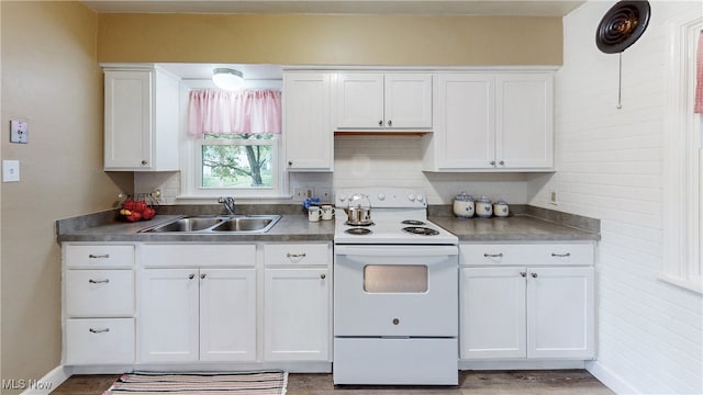 2364 Suncrest Dr, Cuyahoga Falls, OH 44221 - kitchen with white electric stove, a sink, white cabinetry, light wood-type flooring, and baseboards