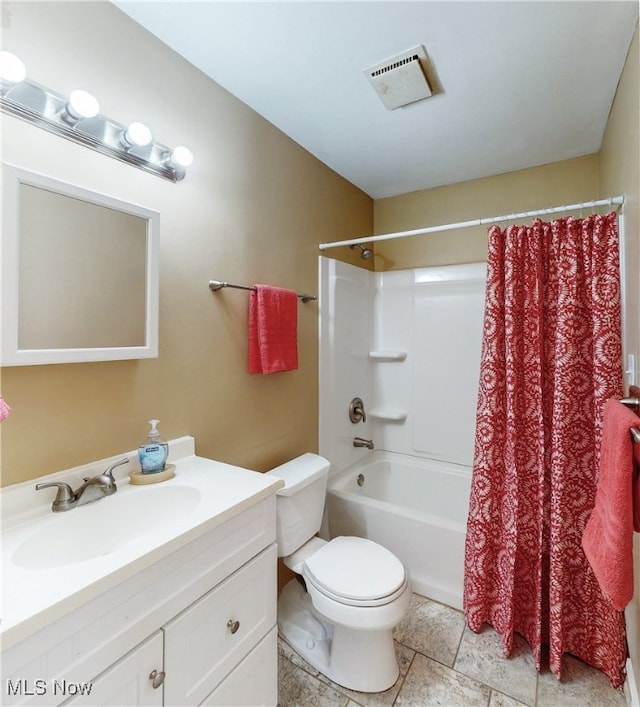 2364 Suncrest Dr, Cuyahoga Falls, OH 44221 - full bath with vanity, toilet, shower / bath combo with shower curtain, and stone finish floors