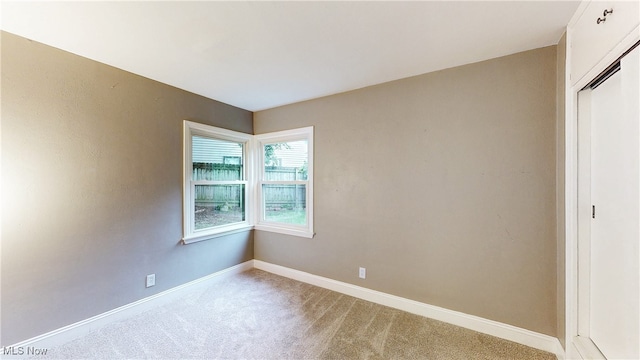 2364 Suncrest Dr, Cuyahoga Falls, OH 44221 - unfurnished room featuring light colored carpet and baseboards
