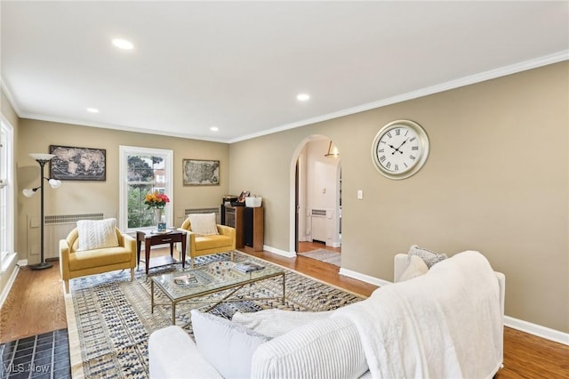 3945 Meadowbrook Blvd, University Heights, OH 44118 - living room featuring arched walkways, crown molding, baseboards, wood finished floors, and recessed lighting
