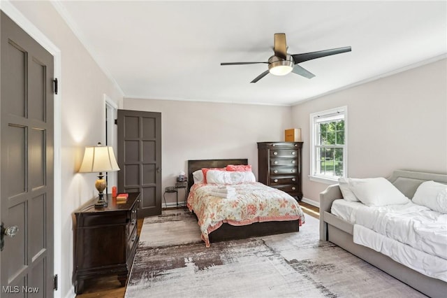 3945 Meadowbrook Blvd, University Heights, OH 44118 - bedroom featuring wood finished floors, crown molding, a ceiling fan, and baseboards