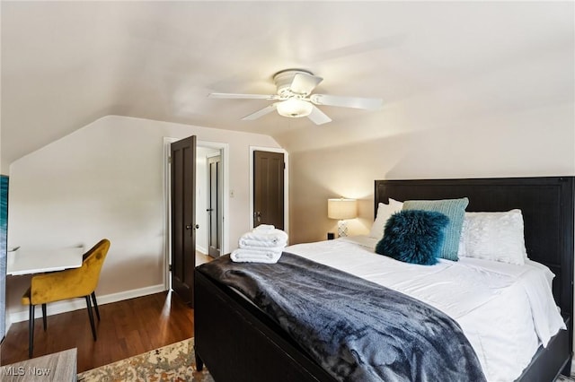 3945 Meadowbrook Blvd, University Heights, OH 44118 - bedroom with dark wood-style floors, vaulted ceiling, ceiling fan, and baseboards