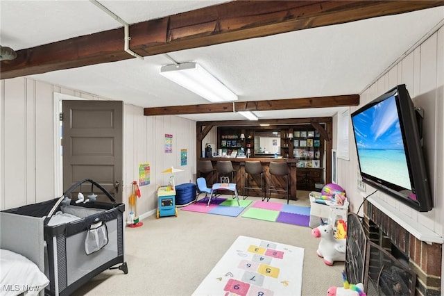 3945 Meadowbrook Blvd, University Heights, OH 44118 - recreation room featuring carpet floors, a bar, beam ceiling, and a decorative wall