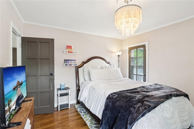 3945 Meadowbrook Blvd, University Heights, OH 44118 - bedroom featuring wood finished floors, crown molding, a chandelier, and baseboards