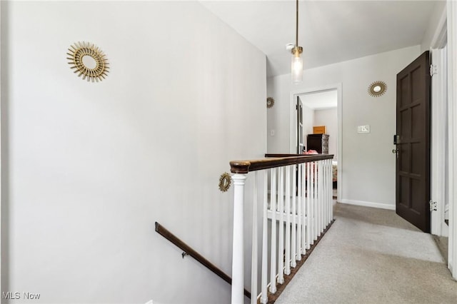 3945 Meadowbrook Blvd, University Heights, OH 44118 - hallway featuring an upstairs landing, carpet floors, and baseboards